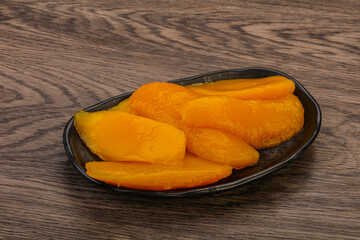 Sweet mango slices in syrop