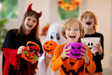 Kids trick or treat. Halloween fun for children.