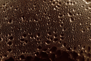 Drops on glass. Texture for designer background. Drops of water flow down the surface of the clear glass on a black background. Raindrops for overlaying on window. Concept of autumn weather.