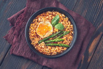 Bowl of ramen with soft-boiled egg and asparagus