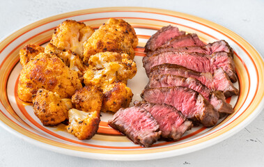 Sliced beef steak with baked cauliflower