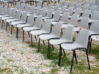 group of empty plastic chair arranged in rows - 454901887