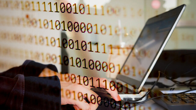 Abstract background of digital binary code of software. Programming software code on computer screen which develop by the programmer to solve the business requirement.	