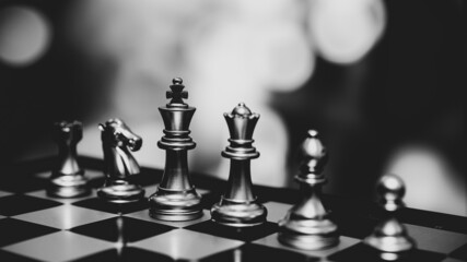 Closeup of chess characters on board games. to represent decision making in term of business strategy to find out the best solution to meet target objective and goal.	
