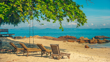 Nature in twilight period which including of sunrise over the sea and the nice beach. Summer beach with blue water and purple sky at the sunset.