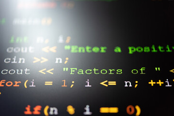 Fototapeta premium Abstract background of digital binary code of software. Programming software code on computer screen which develop by the programmer to solve the business requirement. 
