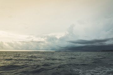 Nature in twilight period which including of sunrise over the sea and the nice beach. Summer beach with blue water and purple sky at the sunset.	
