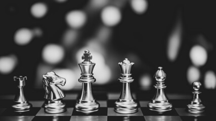 Closeup of chess characters on board games. to represent decision making in term of business strategy to find out the best solution to meet target objective and goal.	
