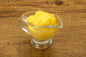 Natural cheese sauce in the bowl