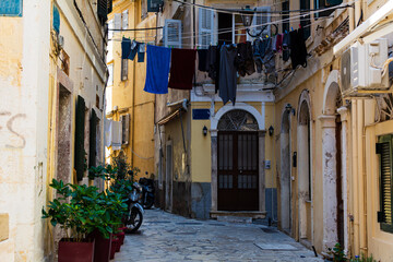 Fototapeta na wymiar Drying laundry hanging in narrow street