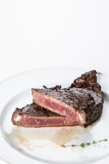 grilled beef fillet steak meat with rosemary isolated on white background