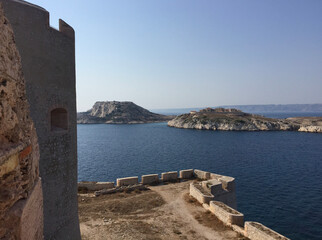 Fototapeta na wymiar View of the Hôpital Caroline on Ratonneau island, seen from Château d’If - a fortress and former prison located on the Île d'If, the smallest island in the Frioul archipelago, next to Marseille. 