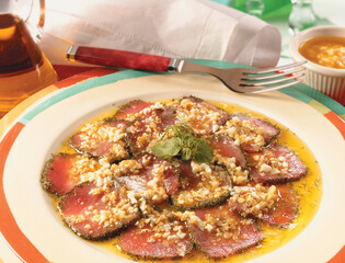 carpaccio de atún  con salsa y huevo duro  para compartir. Tuna carpaccio with sauce and...