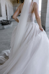 Fototapeta na wymiar White wedding dress dressed on the bride for the engagement ceremony