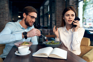 business man and woman sitting in cafe lunch communication lifestyle