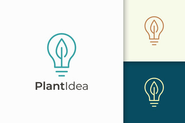 Light bulb and leaf logo in simple style represent energy and innovation