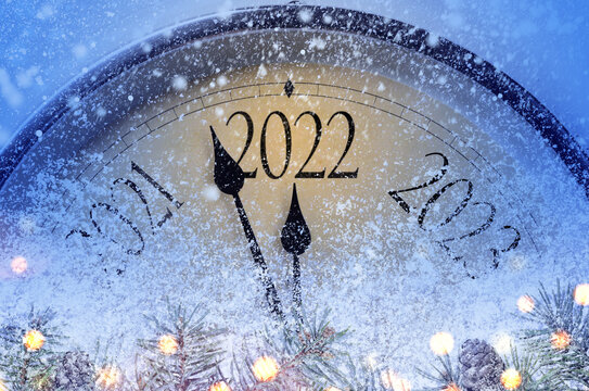 Countdown to midnight. Retro style clock counting last moments before Christmas or New Year 2022