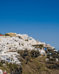 Beautiful Cycladic white architecture. Cityscape of village Imerovigli. Town on hill. Santorini.