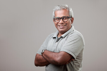 Mature man of Indian ethnicity with a smiling face expression