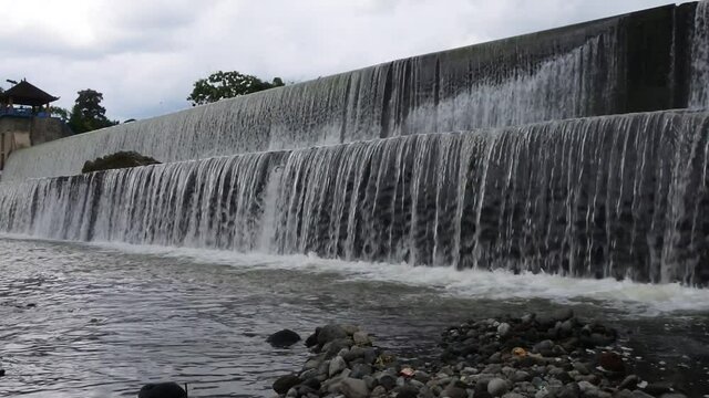 waterfall flow at the tukad unda dam, Bali