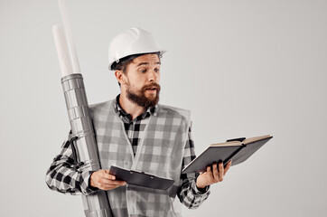 engineer in an orange helmet blueprints Professional light background