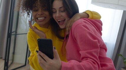 female friends fooling around at home