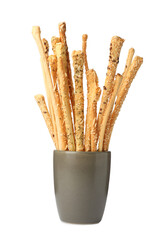 Delicious grissini sticks in cup on white background