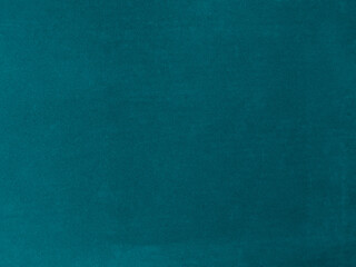 Dark green velvet fabric texture used as background. Empty dark green  fabric background of soft and smooth textile material. There is space for text.