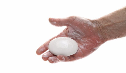 Soap in hand with suds isolated on white background