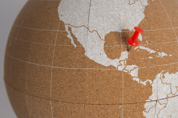World cork ball showing Mexico with 1 red thumbtack marking Cancun - background - Plan destinations...