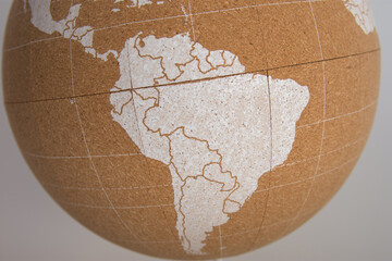World cork ball showing brazil area in white color, background - Plan destinations - Places visited - Next destinations