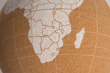 World cork ball showing southern Africa and Madagascar, in white, background - Plan destinations -...