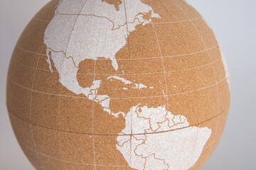 World cork ball with the central area of America in white color, white background - Plan...