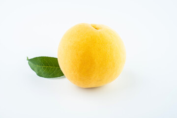 Yellow peach on white background