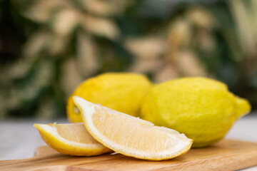 Eureka lemon on wooden table background.