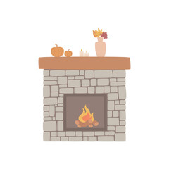 Fireplace made of natural stone with autumn decor and a bright burning flame, pumpkin, candles, autumn bouquet.