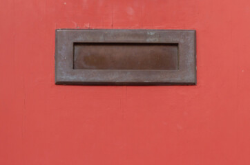 Old letterbox in the door, traditional way of delivering letters to the house, old mailbox