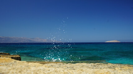 Obraz premium sea and sky view from the top of the cliff looking the greek island of Naxos August 2921