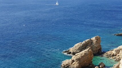 yacht in the blue sea rocks and sea  kato koufonisi island Cyclades Greece
