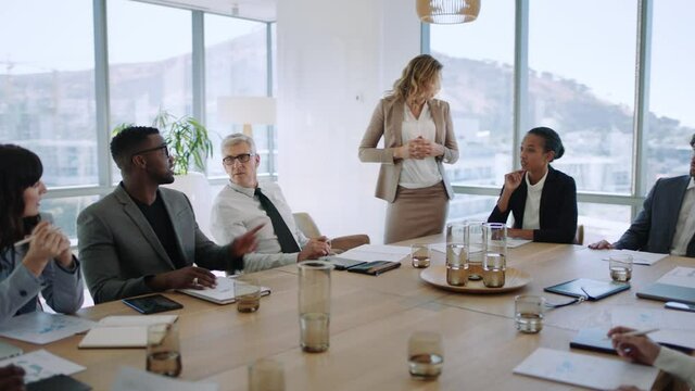 beautiful business woman team leader discussing creative ideas with shareholders briefing colleagues sharing company development strategy in office boardroom meeting 4k