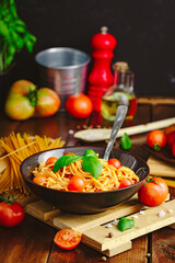 Spaghetti with meat, tomatoes and basilium