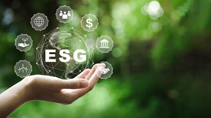 ESG icon concept in the hand for environmental, social, and governance in sustainable and ethical...
