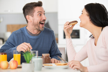 happy husband in the kitchen with his wife
