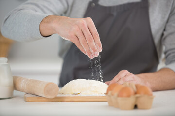 a man is making dough