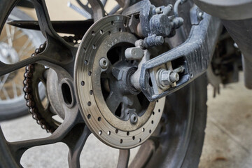 close up motorcycle brake and wheel. motorbike brake and wheel. motor, chain rotor                          