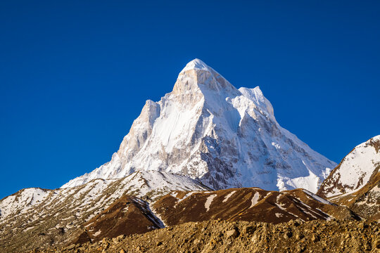 Sunrays falling on peaks of Mount Shivling during sunrise from Bhojbasa. Shivling with an elevation of 6543m  is a mountain in the Gangotri Group of the Garhwal Himalayas at Uttarakhand, India.