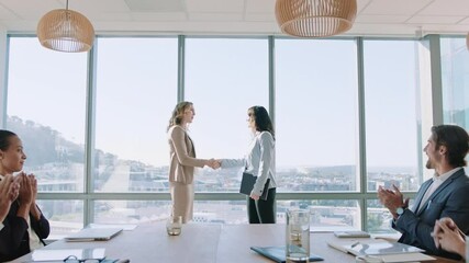 business women shaking hands in boardroom meeting successful corporate partnership deal with handshake colleagues clapping hands welcoming opportunity for cooperation in office 4k