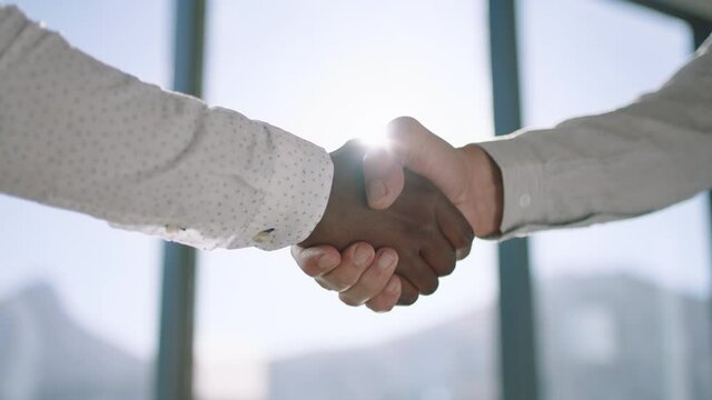 close up business people shaking hands successful corporate partnership deal welcoming opportunity for cooperation in office 4k footage