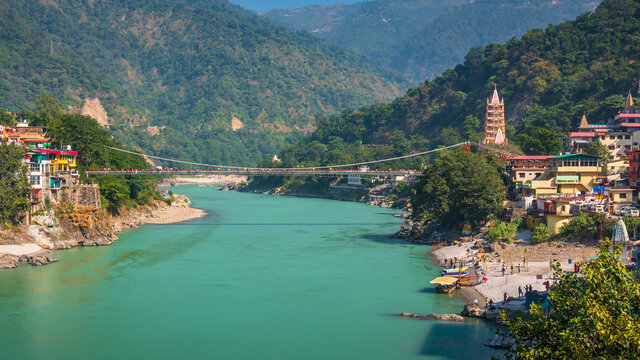 Spectacular panoramic cityscape of Rishikesh, the yoga capital of World located in foothills Himalayas along banks of river Ganga or Ganges in Uttarakhand state of India.