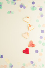 Heart shaped cookies with colorful festive confetti
